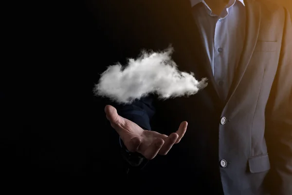 Businessman hand holding cloud.Cloud computing concept, close up of young business man with cloud over his hand.The concept of cloud service