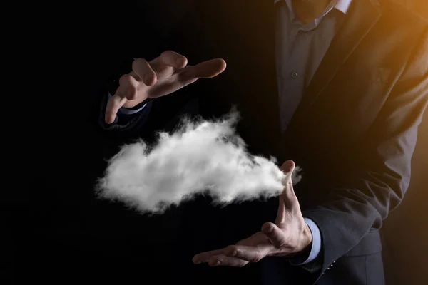 Businessman hand holding cloud.Cloud computing concept, close up of young business man with cloud over his hand.The concept of cloud service