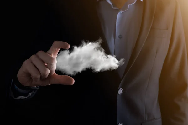 Businessman hand holding cloud.Cloud computing concept, close up of young business man with cloud over his hand.The concept of cloud service