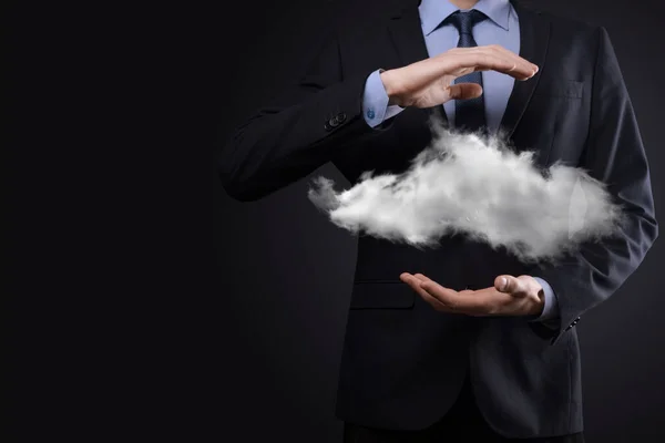 Businessman man hand holding cloud.Cloud computing concept, close up of young business man with cloud over his hand.The concept of cloud service