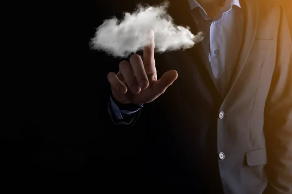 Businessman man hand holding cloud.Cloud computing concept, close up of young business man with cloud over his hand.The concept of cloud service.