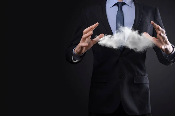 Businessman man hand holding cloud.Cloud computing concept, close up of young business man with cloud over his hand.The concept of cloud service