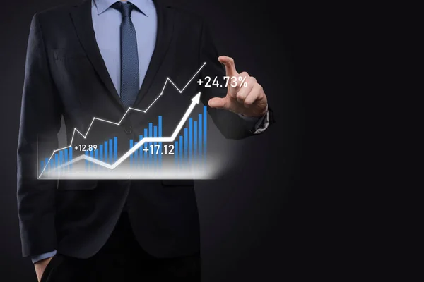 Businessman on a black background presses, presses a finger on a positive growth arrow. Graphs of indicators. Business development and finance concept.