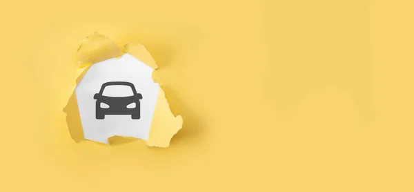 Car automobile insurance and car services concept. Torn yellow paper with auto machine car icon on white background.