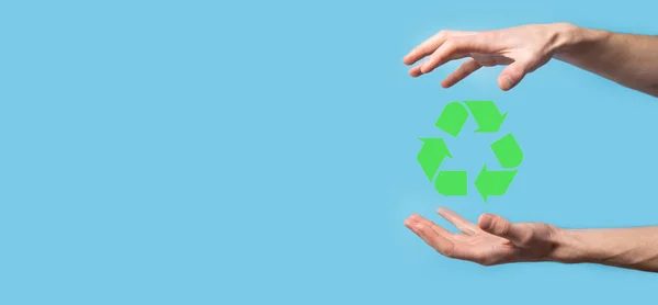 Hand hold recycling icon.Ecology and renewable energy concept.ECO sign, Concept Save green planet. Symbol of environmental protection.Recycling waste.Symbol of earth day, concept of nature protection.