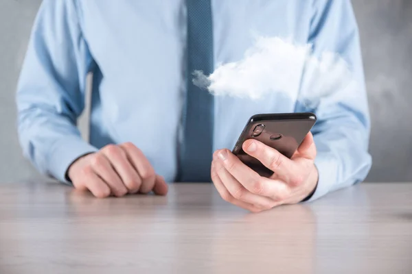 Businessman hand holding cloud.Cloud computing concept, close up of young business man with cloud over his hand.The concept of cloud service