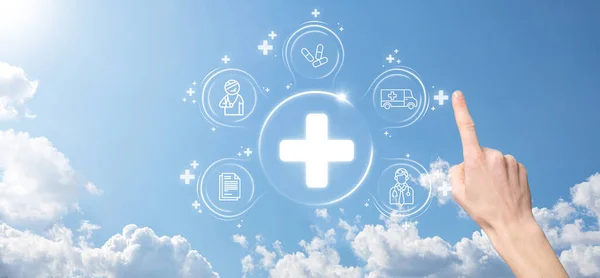 Businessman hold virtual plus medical network connection icons. Covid-19 pandemic develop people awareness and spread attention on their healthcare.Doctor,document,medicine,ambulance,patient icon