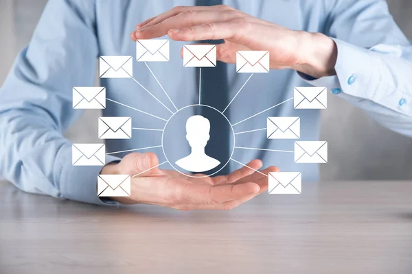 Male hand holding letter icon,email icons .Contact us by newsletter email and protect your personal information from spam mail. Customer service call center contact us.Email marketing and newsletter.