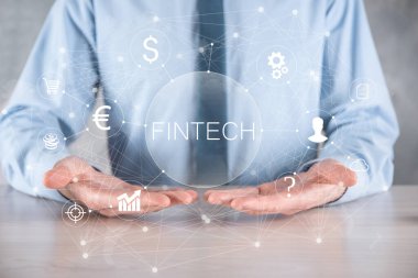 Fintech-Finansal Teknoloji konsepti işadamında. Yatırım bankacılığı ödemesi. Kripto para yatırımı ve dijital para. Sanal ekranda iş kavramı