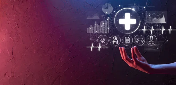 Businessman hold virtual plus medical network connection icons. Covid-19 pandemic develop people awareness and spread attention on their healthcare.Doctor,document,medicine,ambulance,patient icon