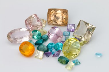 Set of natural colored gemstones: amethyst, topaz, Kunzite apatite, lemon quartz, fire opal. clipart
