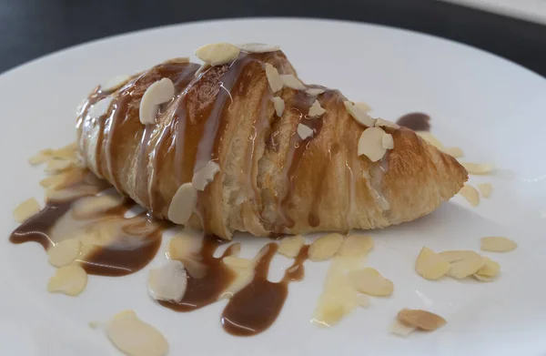 Baked Croissant Caramel Syrup White Plate Homemade Breakfast Almond — Stock Photo, Image