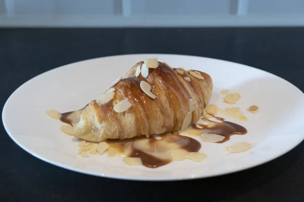 Baked Croissant Caramel Syrup White Plate Homemade Breakfast Almond — Stock Photo, Image