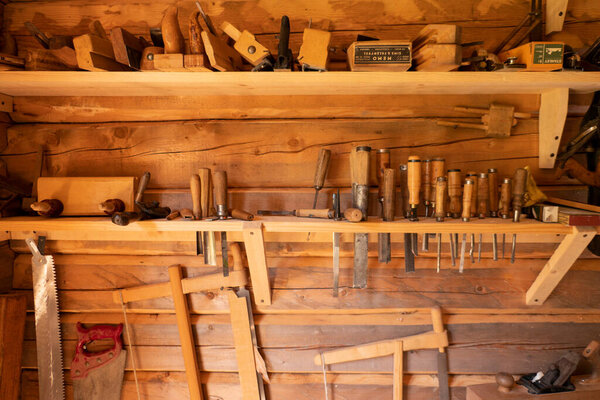vintage woodworking tools on a rough workbench. carpentry, craftsmanship and handwork concept