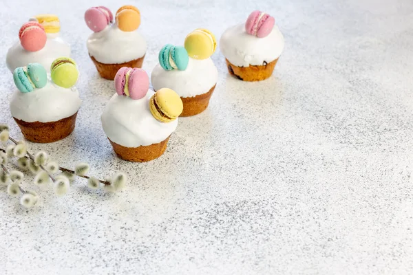 Easter mini cupcakes are decorated with mini macaroons. Easter. For kids.