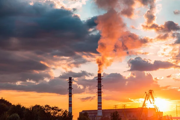 Thermal power plant at dusk. Smoking stack of the thermal power station