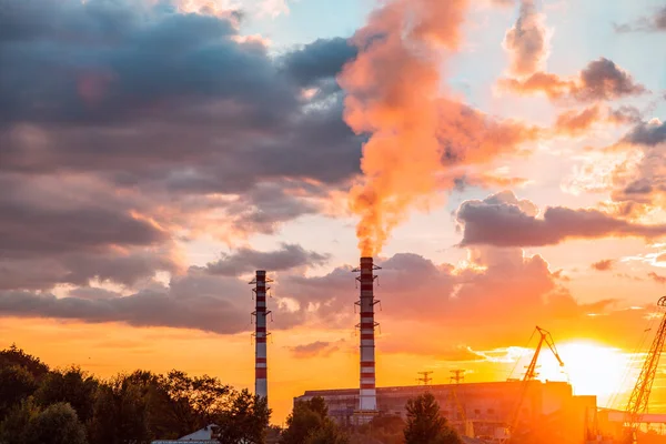 Thermal power plant at dusk. Smoking stack of the thermal power station