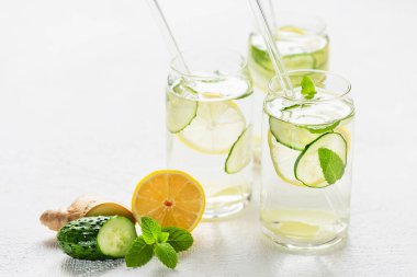 Sassi water. Detox drink with lemon, cucumber, ginger and mint. Healthy food concept clipart