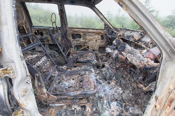 Looking into a burnt out car interior