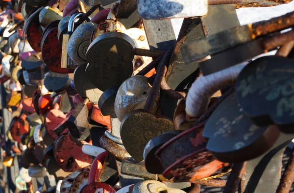 Love Padlocks Lockers at the bridge in Russia. People have place padlocks on the fence symbolizing forever love