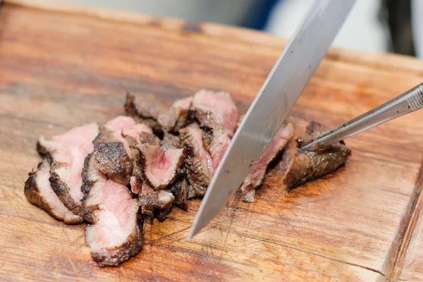 Chopped tenderloin Beef Steak by master chef on wooden board background
