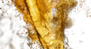 Beyaz zemin üzerinde bokeh olan soyut altın sıçrama