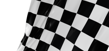 Damalı bayrak gururla sallanıyor, ırkın, rekabetin ve bitiş çizgisinin sembolü.