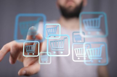 Ekrandaki online alışveriş arabası simgeleriyle etkileşime giren adam