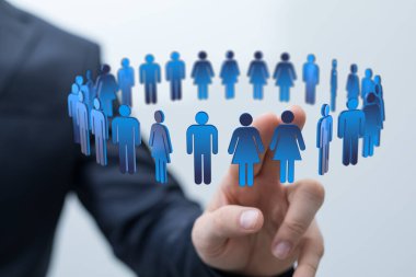 Çemberdeki insan simgeleri takım çalışmasını ve ellerle işbirliğini temsil ediyor..