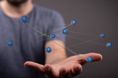 Elinde fütüristik bir ağ çizimi tutan adam.