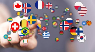 Küresel bağlantıları temsil eden çeşitli uluslararası bayraklarla insan eli etkileşimi