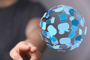 Parmaklara bağlı konuşma baloncukları küresel iletişimi gösterir