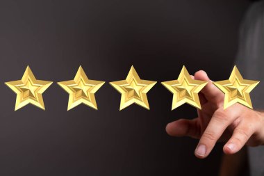 El Dokunuşu Beş Altın Yıldız En İyi Değerlendirme veya Gözden Geçirmeyi sembolize ediyor