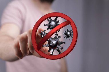 Coronavirus önleme kavramı ve elinde bir virüs simgesi var.