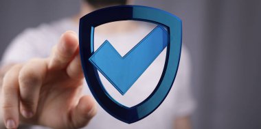 Kişi işaretli dijital bir kalkanı işaret eder.