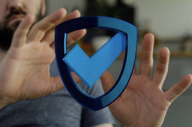 Güvenliği temsil eden kişi tarafından tutulan İşaretli Kalkan