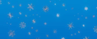 Zarif kar tanelerini içeren büyüleyici bir görüntü canlı mavi gökyüzüne doğru zarif bir şekilde düşüyor ve kış harikalar diyarının özünü yakalıyor..