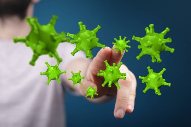 Hastalık ve salgını temsil eden virüs modelleriyle etkileşim halinde olan bir adam.