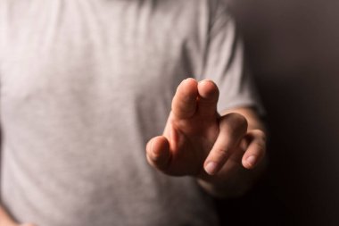 Man's hand pointing at something, creative concept, touching