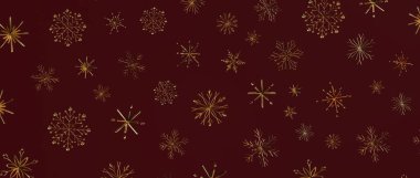 Noel için koyu kırmızı arka planda zarif altın kar taneleri deseni