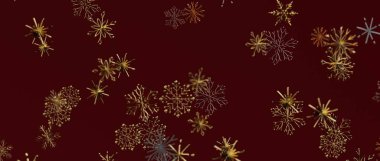 Noel dekoru için kırmızı arka planda zarif altın kar taneleri.