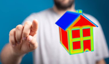 El, teknoloji ve enerji tasarrufu öneren akıllı ev modeline işaret ediyor