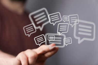 Floating Chat Bubbles Above Hand: Communication, Digital, Connection, Social Media