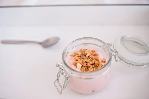 Yogurt and muesli in a jar — Stock Photo, Image