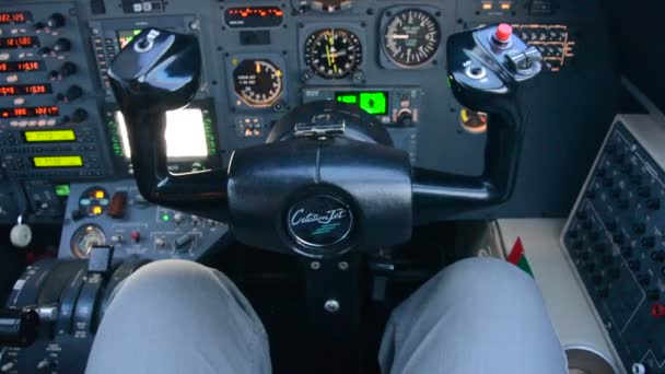 Pilot in an airplane cockpit, airplane instruments — Stock Video