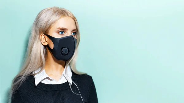 Portrait Young Blonde Girl Wearing Black Medical Mask Cyan Background — Stock Photo, Image