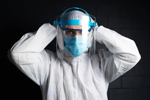 Dark Portrait Young Doctor Wearing Ppe Suit Coronavirus Covid Background — Stockfoto