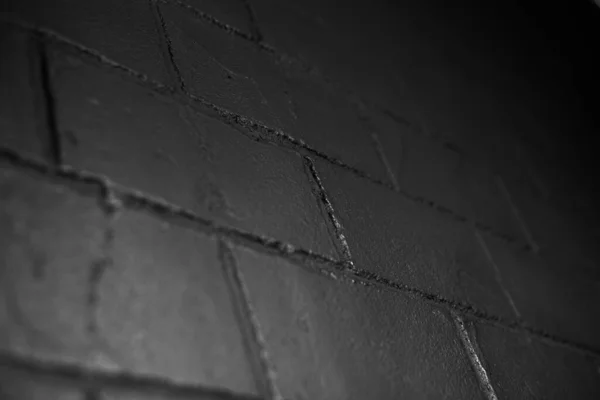 Крупный План Текстурированной Черной Кирпичной Стены — стоковое фото