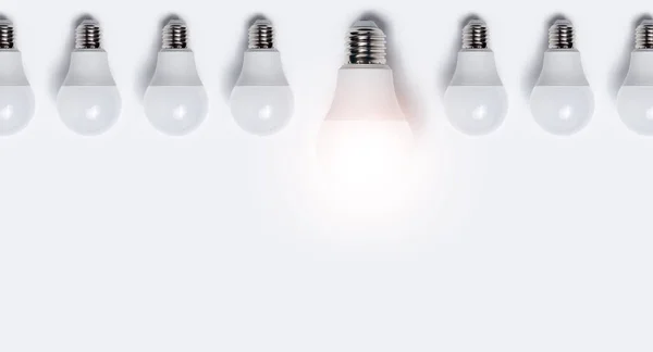 Close Many Light Bulbs One Glowing White Background Business Idea — Stock Photo, Image