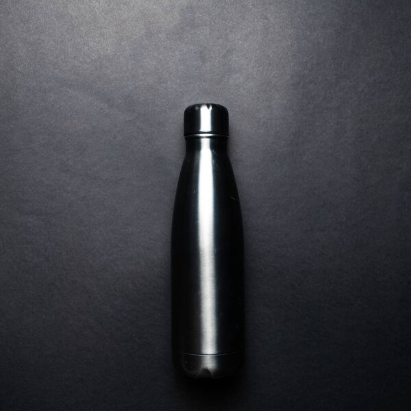 Close-up picture of eco stillness thermo bottle, of dark grey colour.